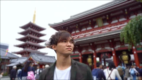 Handsome Young Japanese Man Exploring Senso Ji Shrine in Tokyo - Japanese Stock Footage 98480030