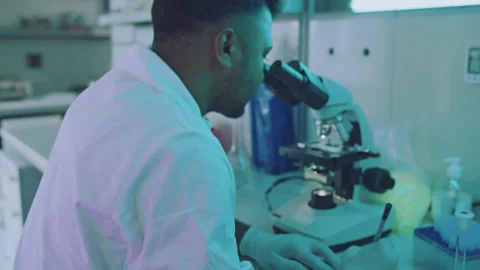 Handsome Young Lab Assistant Writing Down New Information Stock Footage 164992473