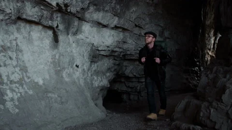 Handsome young man with backpack in the mountains Stock Footage 63096773