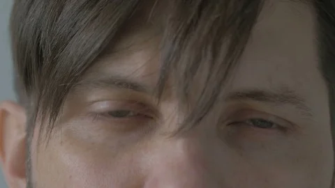 Handsome young man with beard looking directly at the camera Stock Footage 74210787