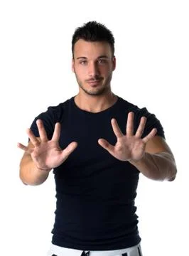 Handsome young man counting to ten with fingers and hands Stock Photos