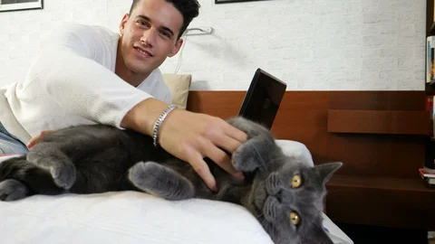 Handsome Young Man Cuddling his Gray Cat Pet Stock Footage 101793242