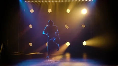 Handsome young man dancing break dance, hip hop, street dancing in studio Stock Footage 138365345