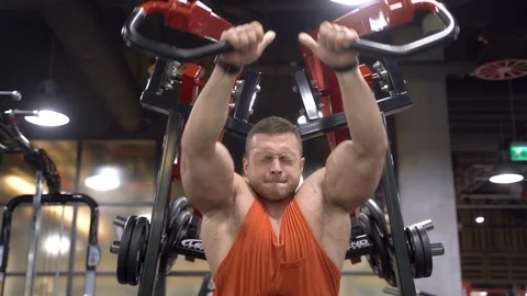 Handsome young man doing exercises in the gym Stock Footage 108794547