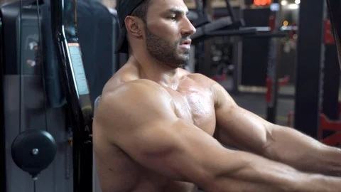 Handsome young man doing exercises in the gym. Stock Footage 108903680