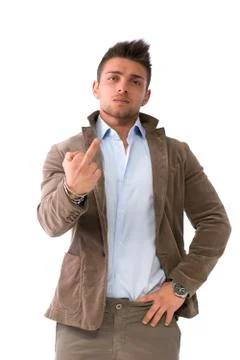 Handsome young man doing 'screw you' sign with middle finger Stock Photos
