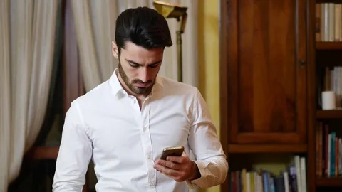 Handsome young man doing selfie at home Stock Footage 83996332