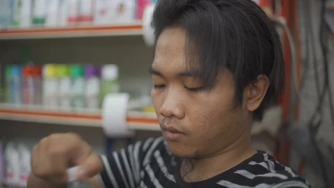 Handsome young man drink plain water after working time Stock Footage 93106903