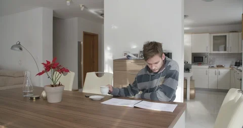 Handsome young man drinking coffee in his home, close up shot. Stock Footage 124103041