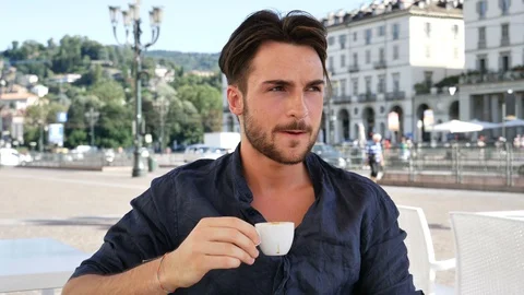 Handsome young man drinking espresso coffee Stock Footage 95764543
