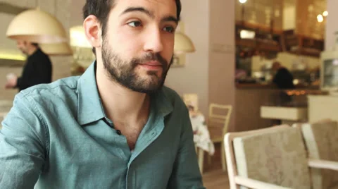 Handsome young man drinking wine in a restaurant Stock Footage 36529732