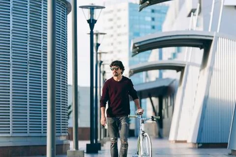 Handsome young man with fixed gear bicycle. Stock Photos