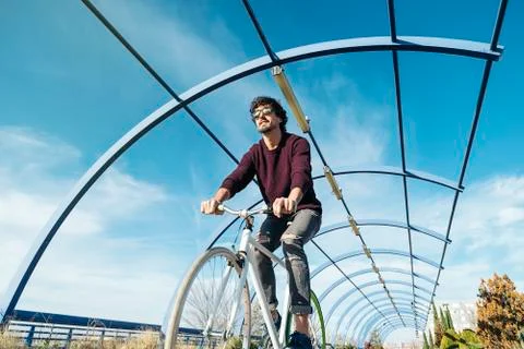 Handsome young man with fixed gear bicycle. Stock Photos