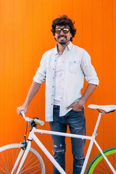 Handsome young man with fixed gear bicycle. Stock Photos
