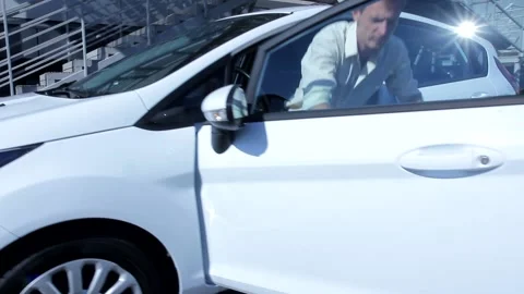 Handsome young man handcuffed to small blue bulletproof protected case get out o Stock Footage 137540674