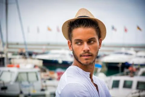 Handsome young man in hat Stock Photos