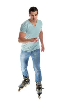 Handsome young man with inline roller skates on white background Stock Photos