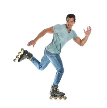 Handsome young man with inline roller skates on white background Stock Photos