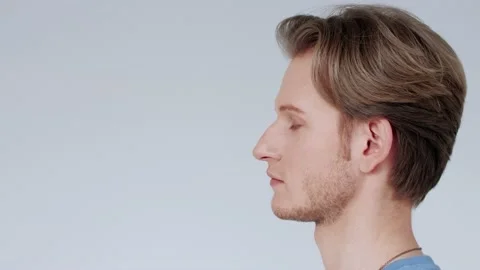 Handsome young man, looking at camera with happy, carefree expression, smiling Stock Footage 131343196