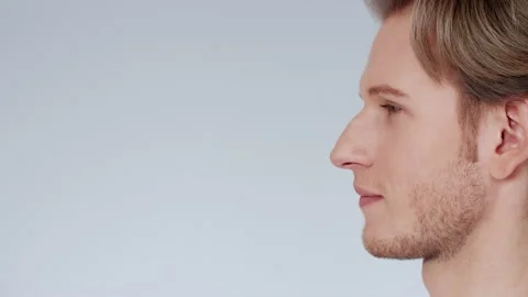 Handsome young man, looking at camera with happy, carefree expression, smiling Stock-Footage 131343683