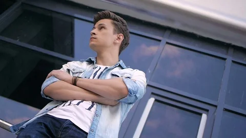 Handsome young man model posing near the window Video stock 72835934