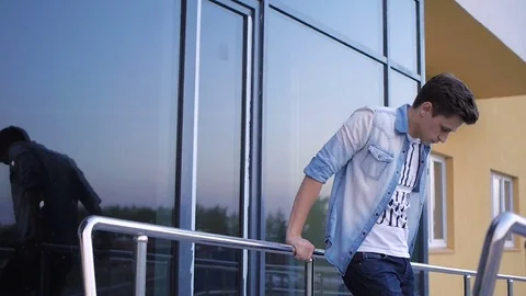 Handsome young man model posing near the window Stock Footage 72836019