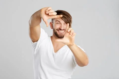 Handsome young man posing at studio Stock Photos