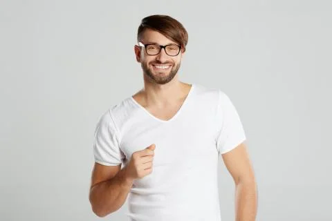 Handsome young man posing at studio Stock Photos