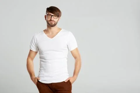 Handsome young man posing at studio Stock Photos