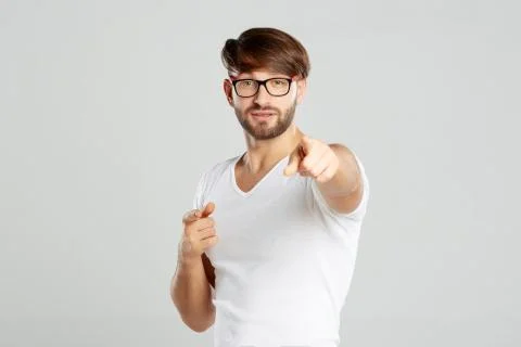 Handsome young man posing at studio Stock Photos