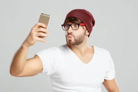 Handsome young man posing at studio Stock Photos