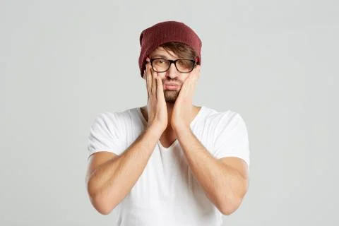 Handsome young man posing at studio Stock Photos