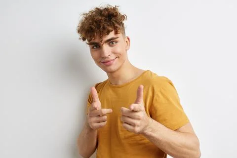 Handsome young man posing studio smile Lifestyle unaltered Stock Photos