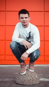 Handsome young man on red background Stock Photos