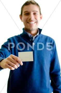Handsome young man showing or giving business card Stock Photos