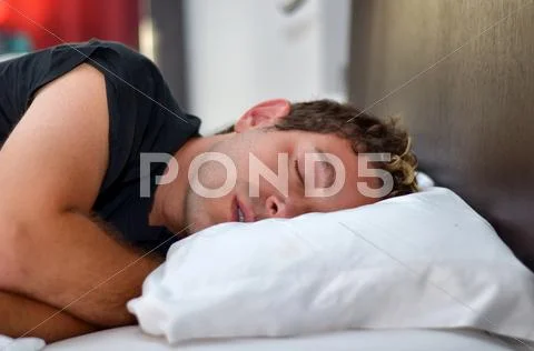 Handsome young man sleeping Stock Photos