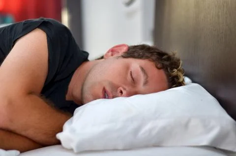 Handsome young man sleeping Stock Photos