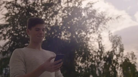 Handsome young man with smartphone outside in the town Stock-Footage 67740786