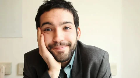 Handsome young man smiling into the camera Stock Footage 36417462