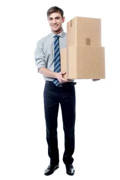 Handsome young man with with stack of boxes Stock Photos