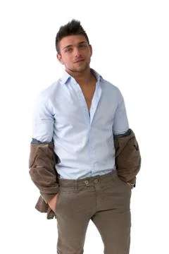Handsome young man standing with jacket pulled down Stock Photos