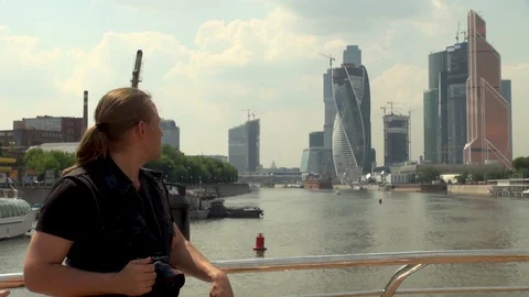 Handsome young man stands on deck of pleasure boat. Close-up. Stock Footage 106607477