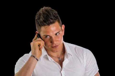 Handsome young man talking on mobile phone Stock Photos