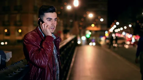 Handsome young man talking on smartphone smiling happy Vídeo Stock 61093739