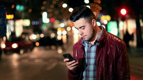 Handsome young man talking on smartphone smiling happy 库存影片 61094007