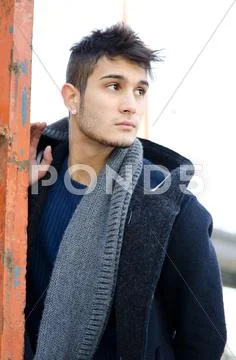 Handsome young man in urban or industrial environment Stock Photos