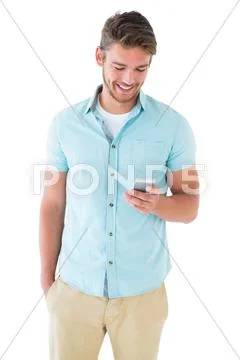 Handsome young man using his smartphone Stock Photos