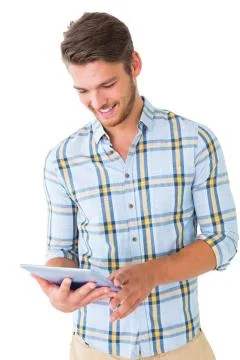 Handsome young man using his tablet pc Stockfoto's