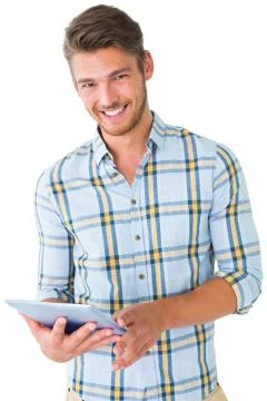 Handsome young man using his tablet pc 写真素材