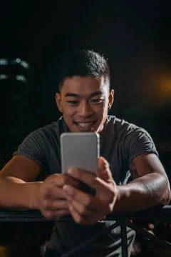 Handsome young man using his mobile. Stock Photos